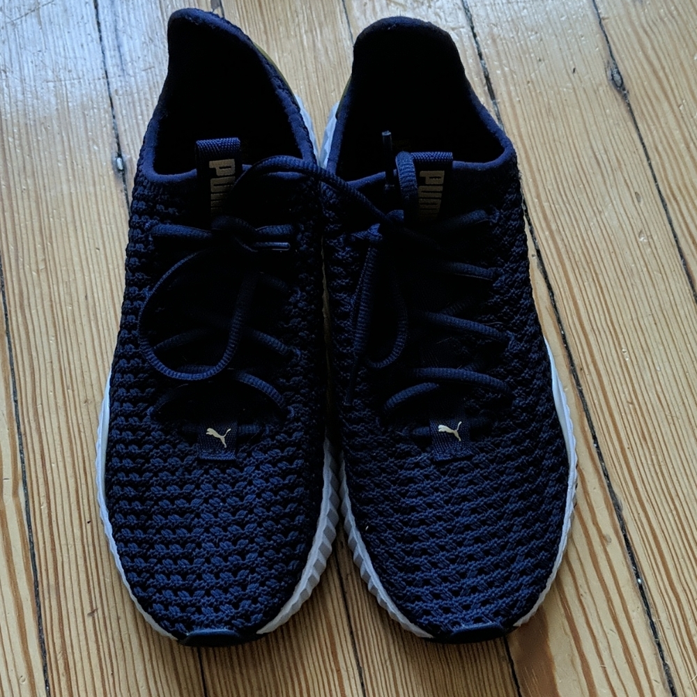 navy and gold netted pumas